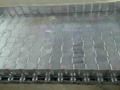 A piece of flat chain plate conveyor belt with side plate and welded washer chains.