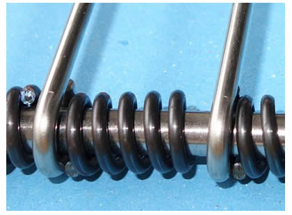 An eye link conveyor belts EBSS with springs as spacers