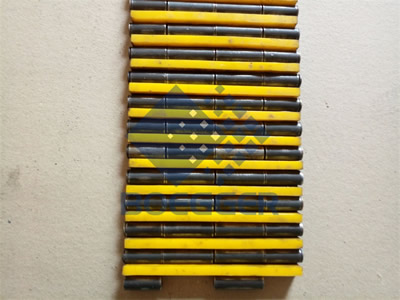 Yellow polyurethanes are assembled between the hinge pins.