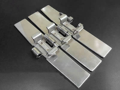 A piece of flat top chain with TAB hinge pins and three chain plates.