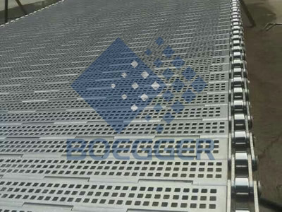 A piece of perforated metal plate conveyor belt with square holes.
