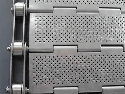 A piece of stainless steel perforated metal plate belt with staggered round holes.