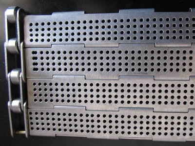 A piece of metal plate belt with several straight round holes on the chain plate.