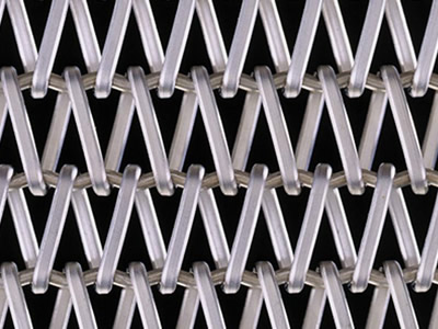 A piece of stainless steel balanced weave oven mesh belt in flat wires on the black background.