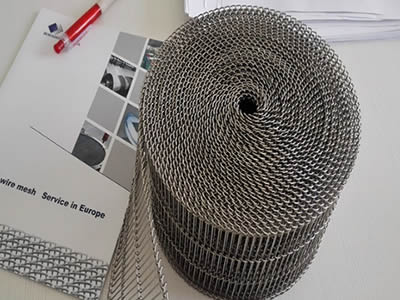 A small roll of rod network belt and a brochure on the table.