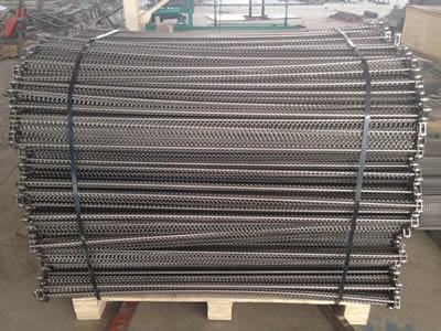 A wooden pallet of stainless steel balanced weave belt in the warehouse.